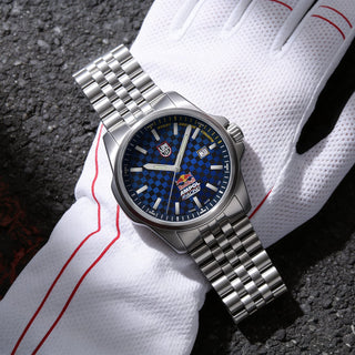 Silver watch with blue dial on a white glove against a dark background - Red Bull Racing, 43 mm, Outdoor Watch - XL.2523.ARB.N